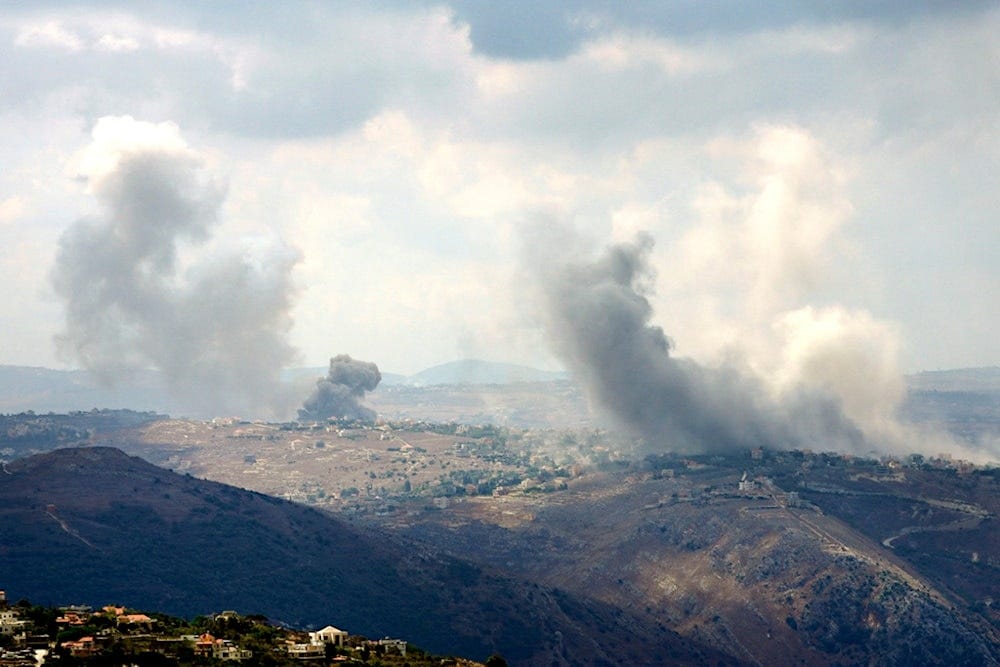 Smoke rises from Israeli airstrikes on Taybeh village, seen from the southern town of Marjayoun, Lebanon, Monday, Sept. 23, 2024.(AP Photo/Hussein Malla)