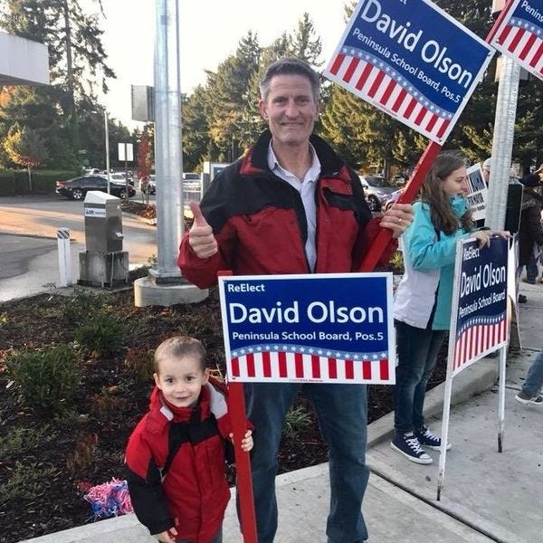 David Olson campaigning for election to school board.