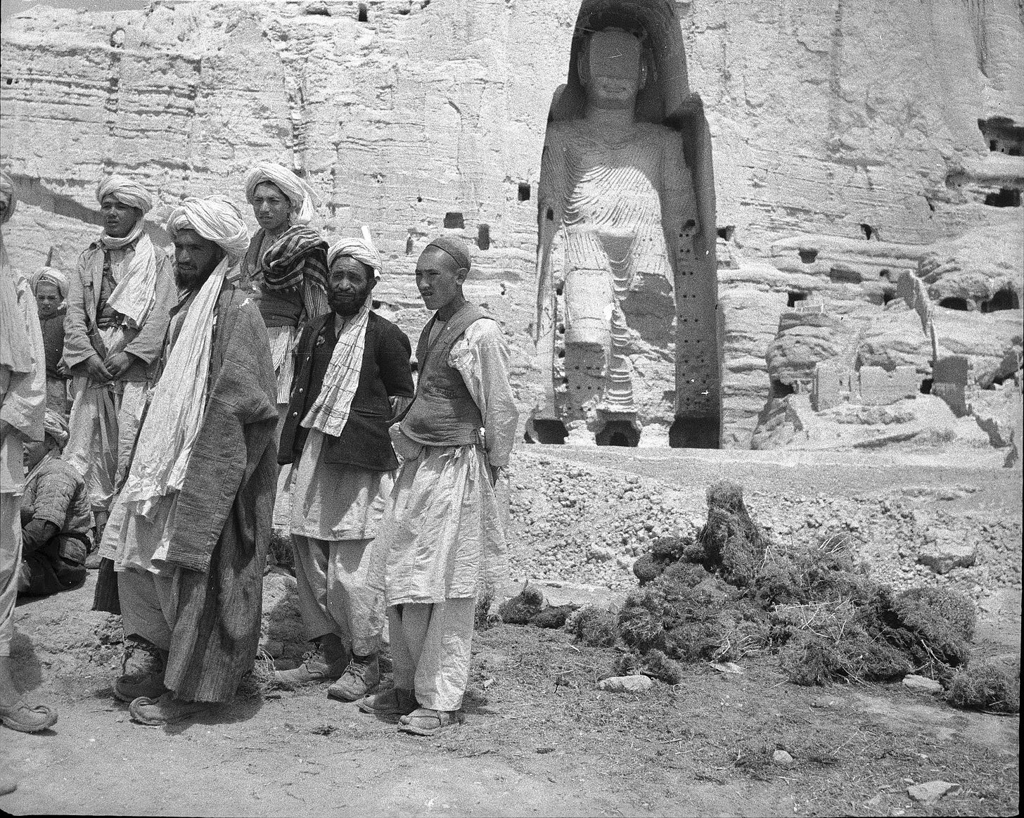 Local men standing near the larger "Salsal" Buddha statue, c. 1940