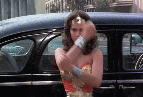 Gif animation of Wonder Woman deflecting bullets with her wrist shield thingies. Bracelets, that's the word. 