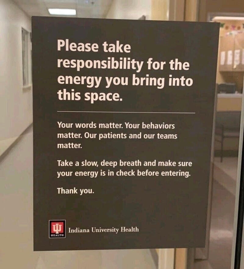 Poster on a glass door that says Please take responsibility for the energy you bring into this space.