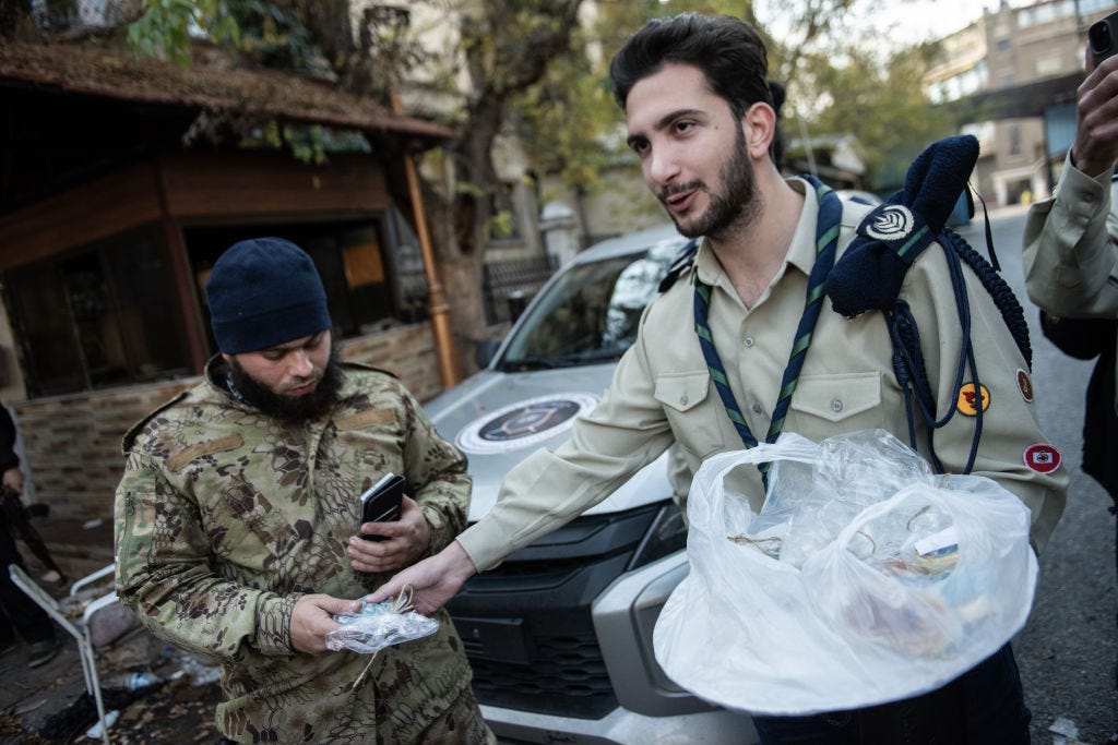 Scouts from Catholic community distribute sweets on the streets of Damascus