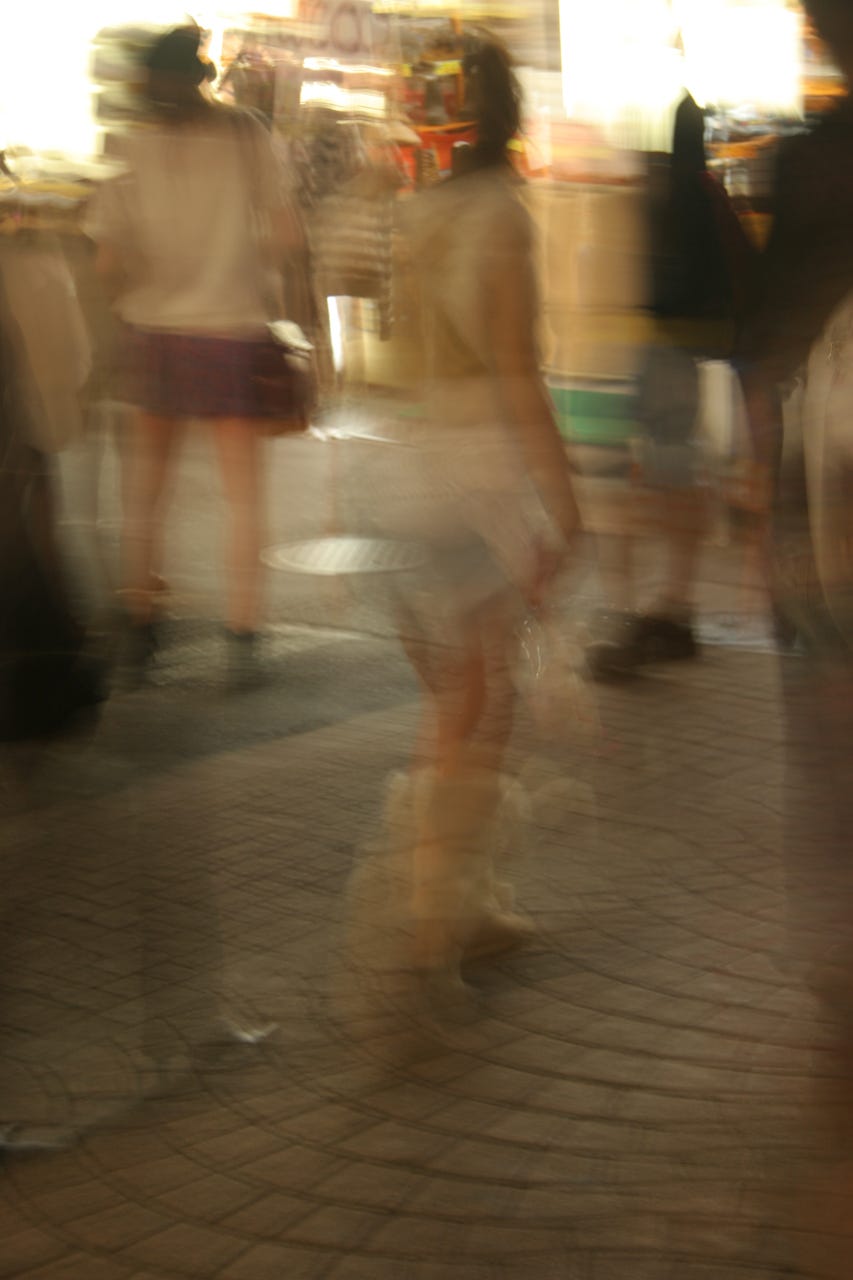 A blurry image of a person walking

Description automatically generated