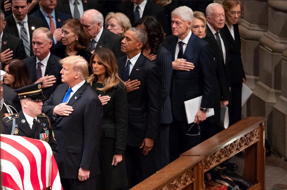 donald trump hand over heard during george bush funeral fake news