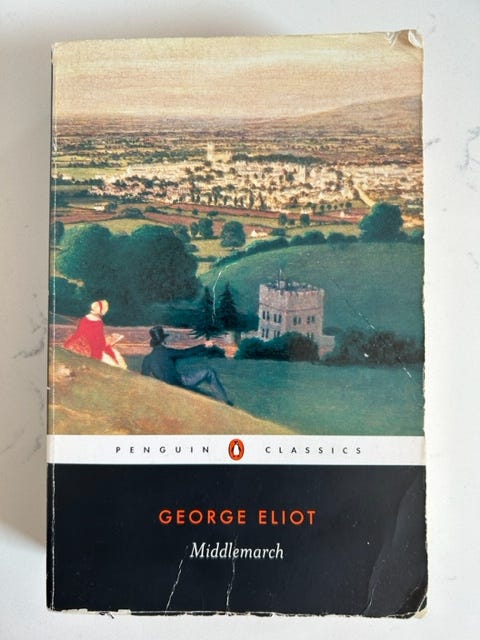 A 19th century couple overlooks a small town on the cover of Middlemarch