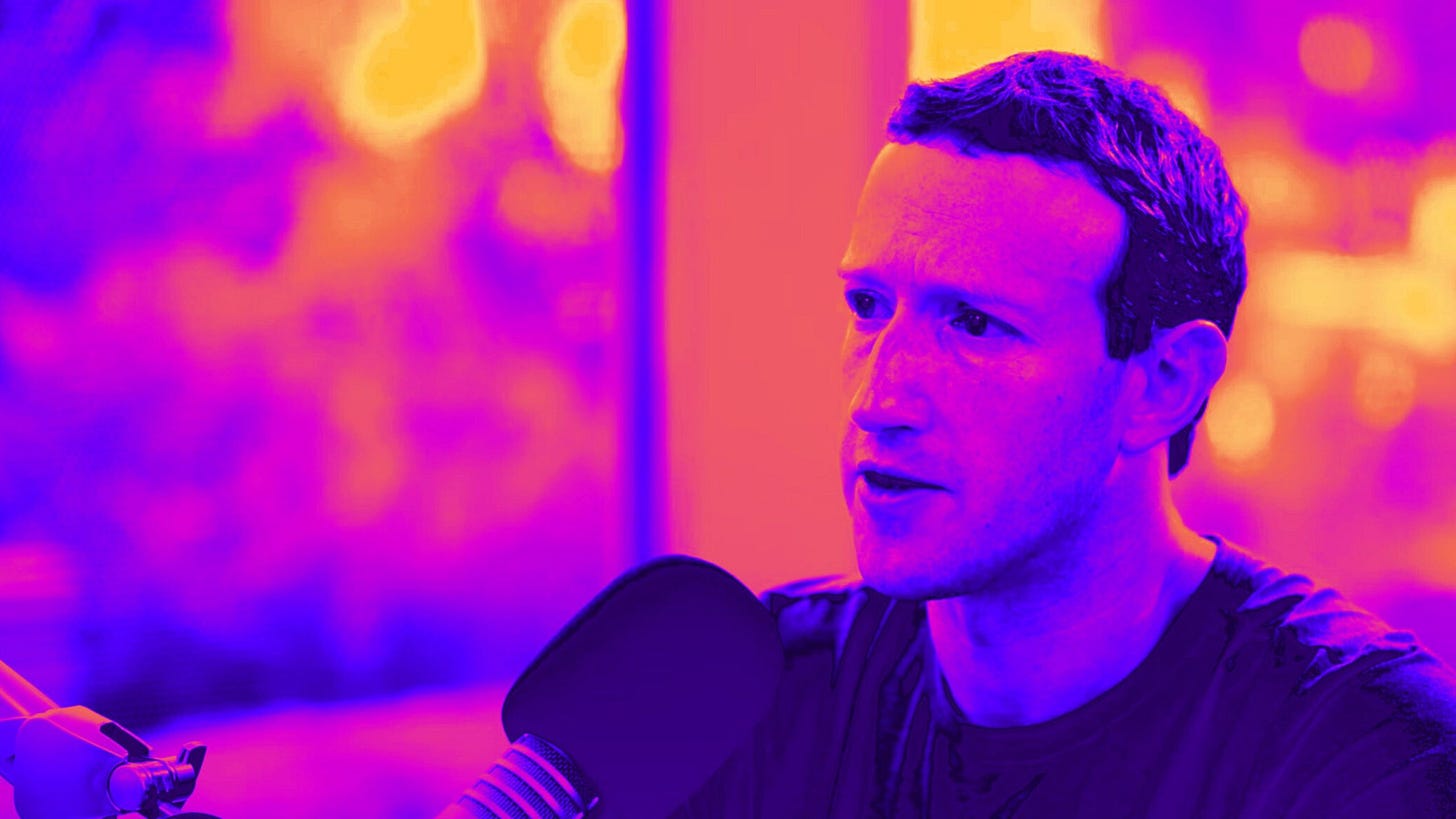 Zuckerberg speaking into a microphone with a colorful, abstract background.