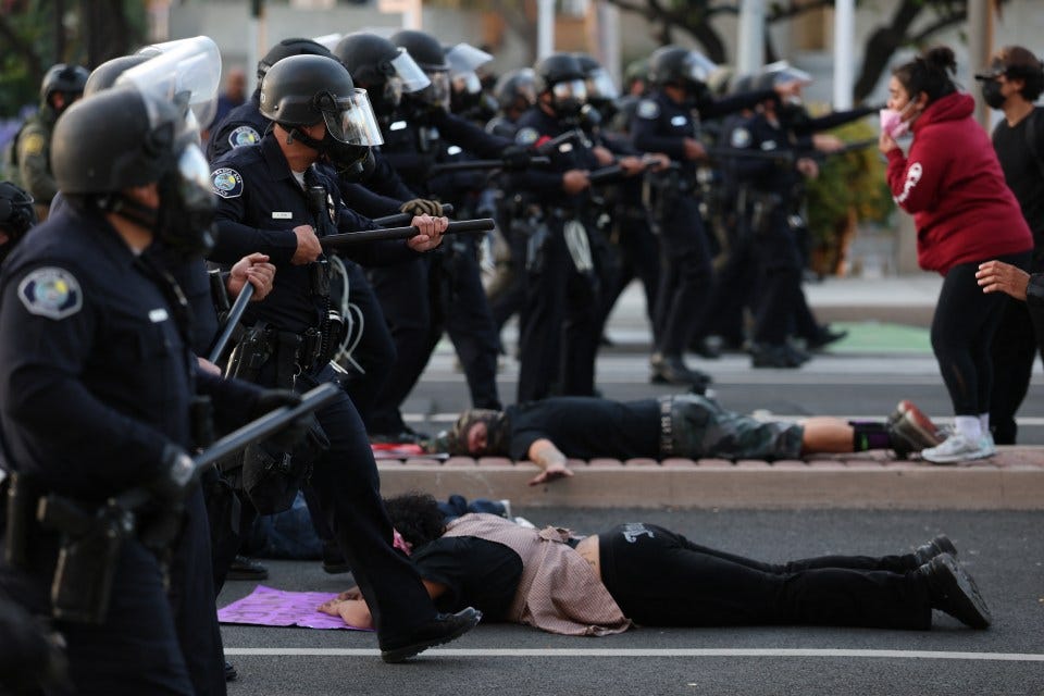 LOS ANGELES, CALIFORNIA - JUNE 08: Los Angeles Police Department (LAPD) officers shoot rubber bullets at protesters in front of the City Hall on June 08, 2025 in Los Angeles, California. Tensions in the city remain high after the Trump administration called in the National Guard against the wishes of city leaders following two days of clashes with police during a series of immigration raids. (Photo by Apu Gomes/Getty Images)