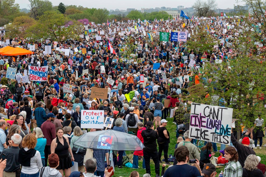 Thousands of demonstrators gather on the National Mall in Washington, DC, on April 05, 2025, during the "Hands Off!" day of action—a massive protest against the policies of the Trump administration and Elon Musk. (Photo by Probal Rashid/Sipa USA)(Sipa via AP Images)