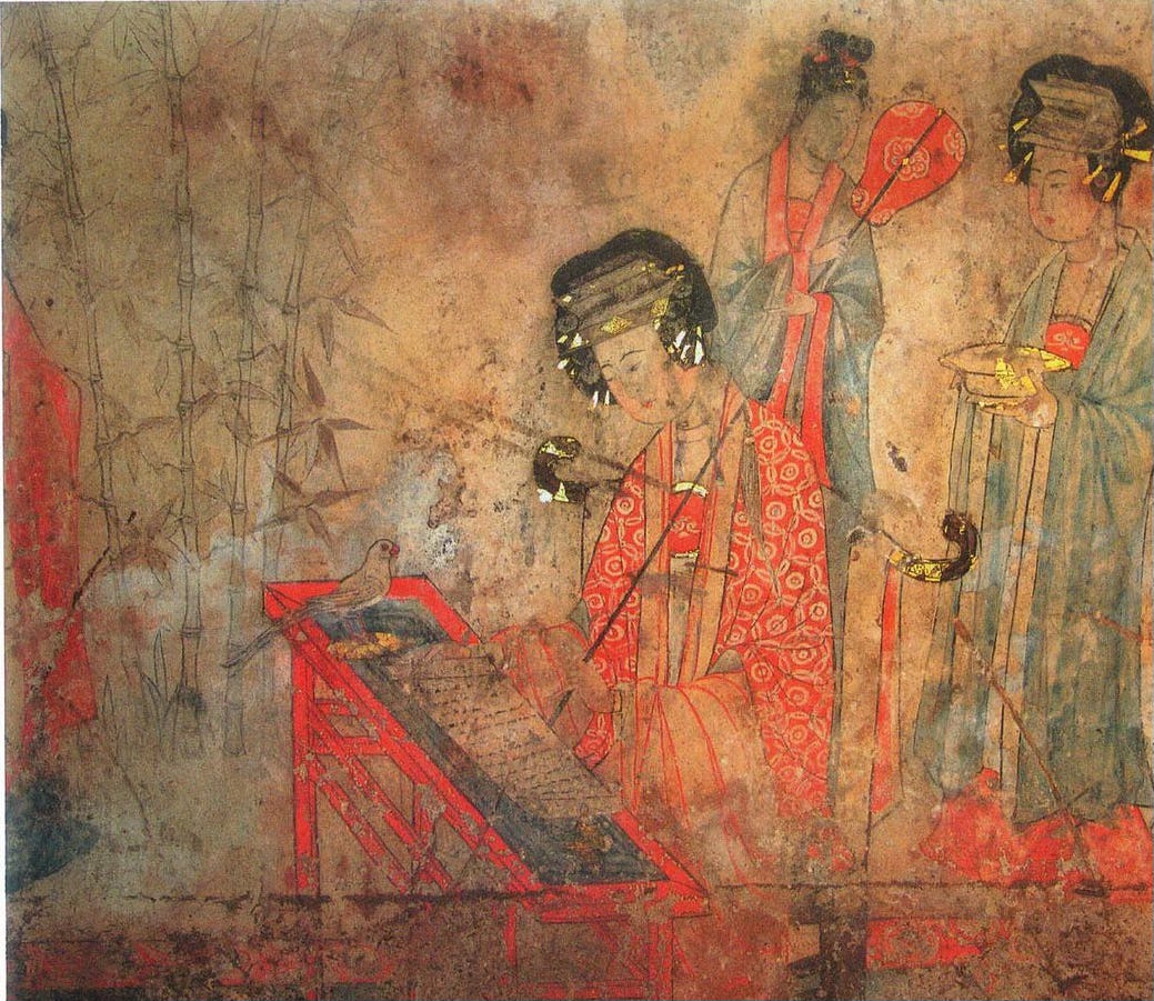 Tomb mural, Baoshan: Precious Consort Yang sits at a desk reading a scroll - presumably the Heart Sutra - with a white bird standing on the desk in front of her.