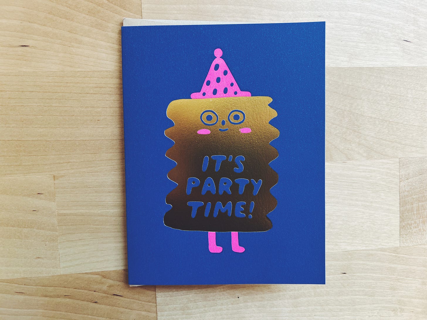 Blue card with a gold blob wearing a party hat that says "it's party time"