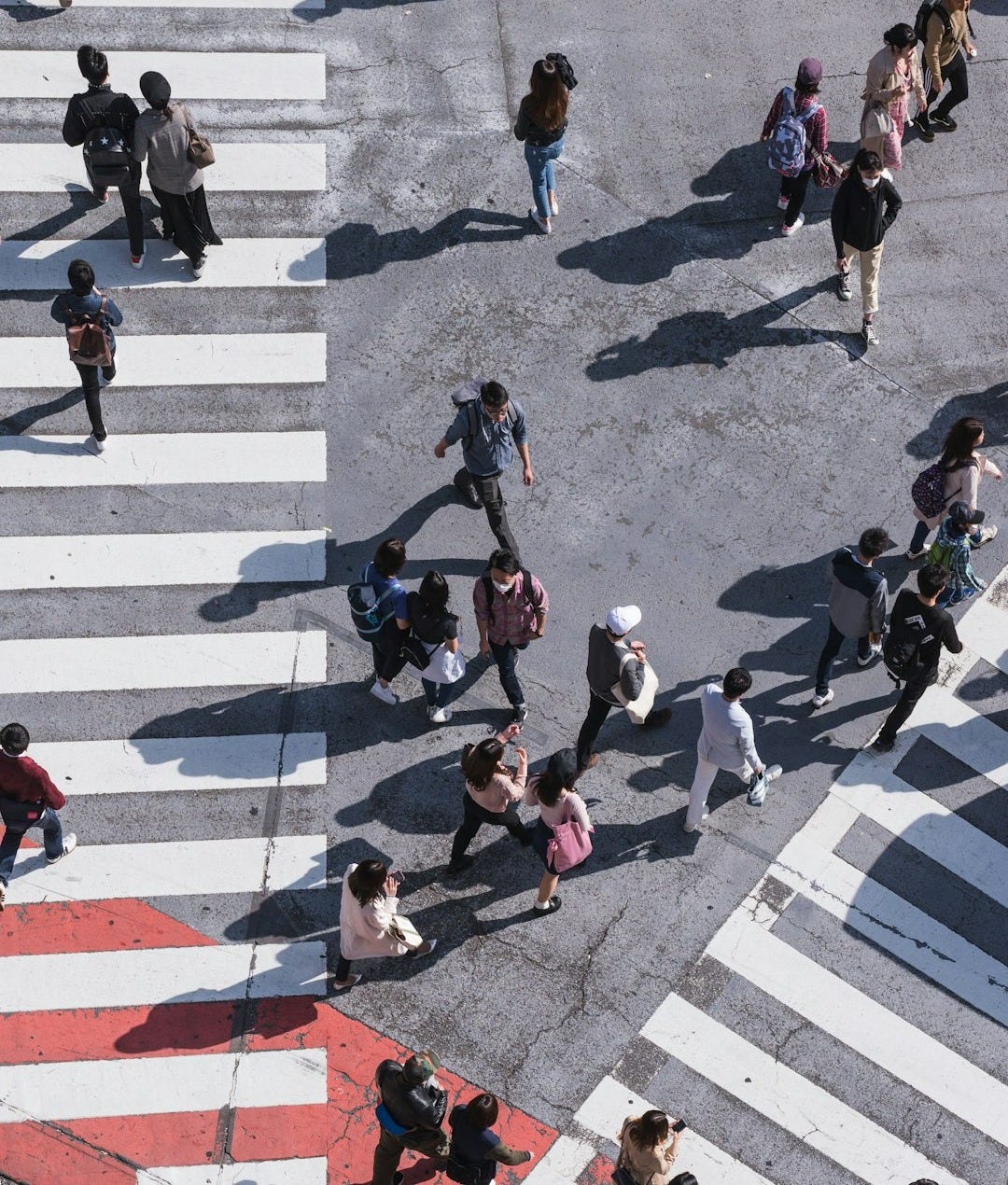 aerial photography of people crossing pedestrian lane aerial photography of people crossing pedestrian lane