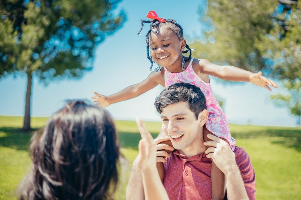 a happy family playing