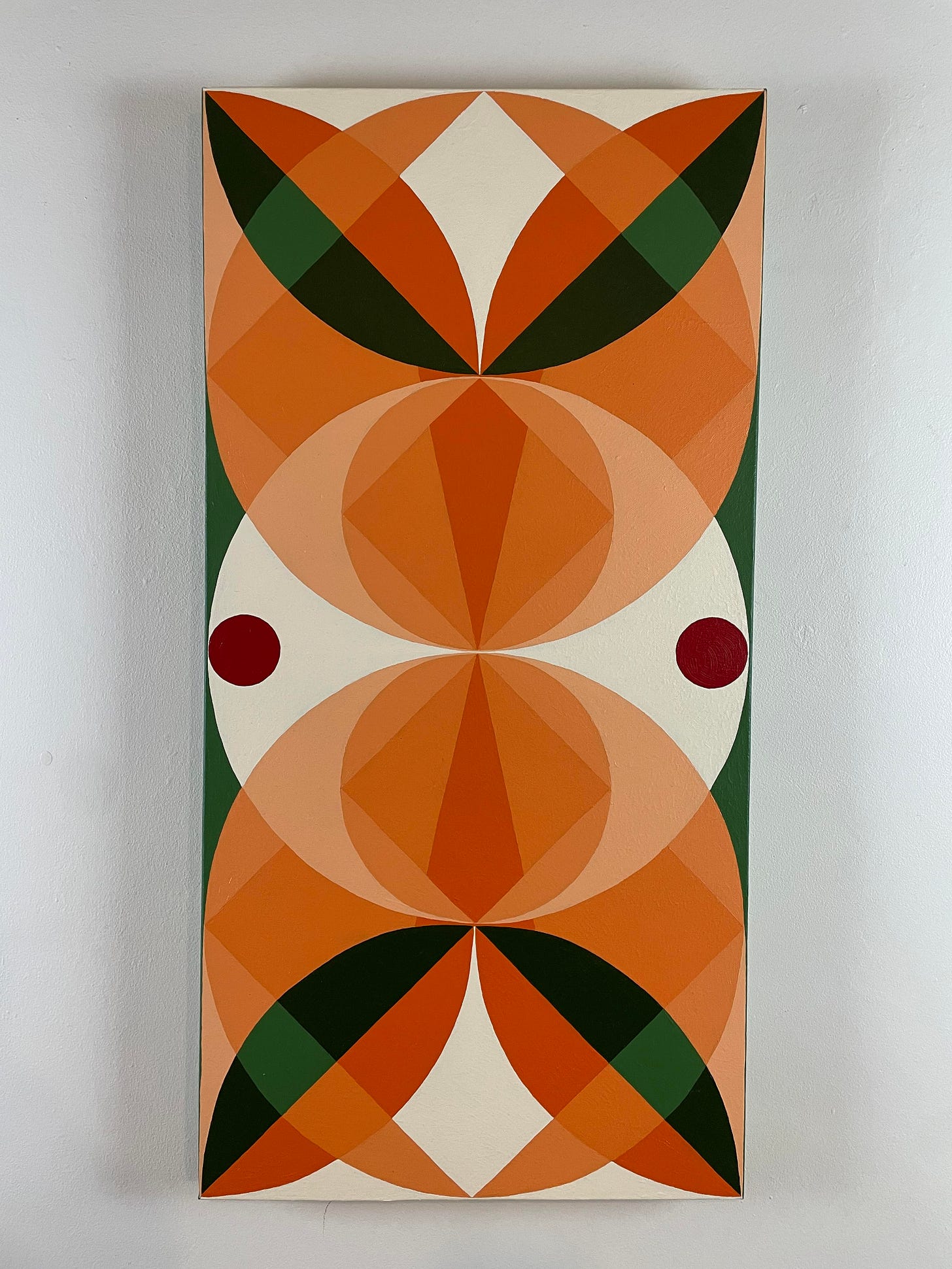 Painting with geometric circular shapes in white, greeen, red and orange