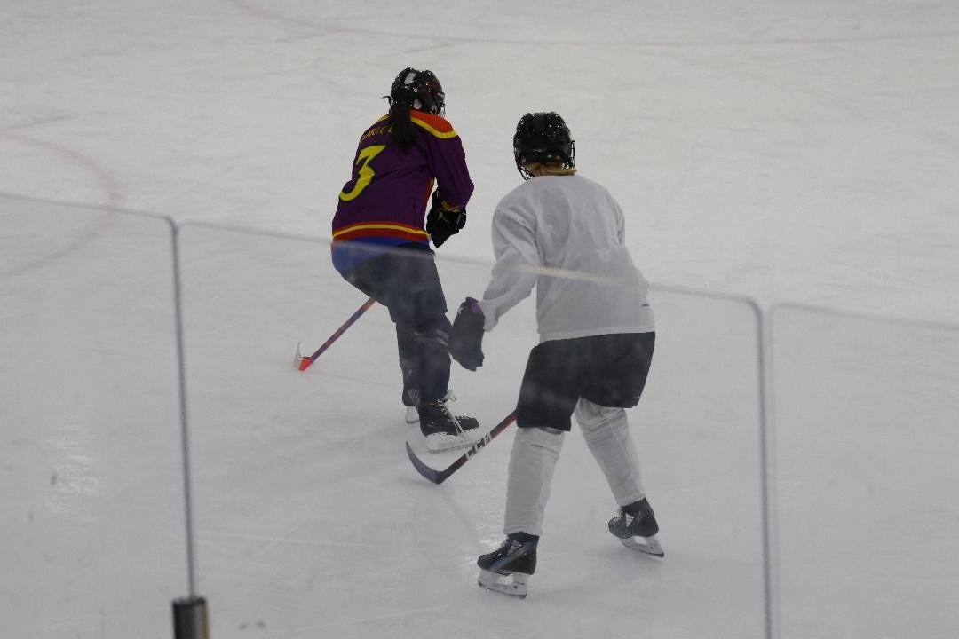 My child on the ice chasing down an opponent