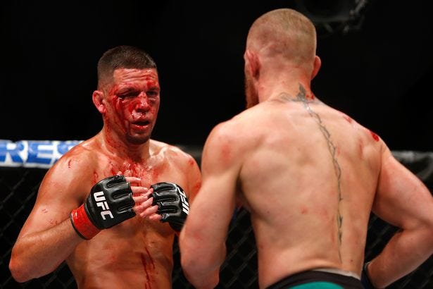 nate diaz bloody face with conor mcgregor ufc 202