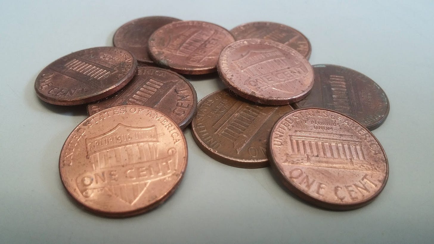 A group of worn pennies A group of worn pennies