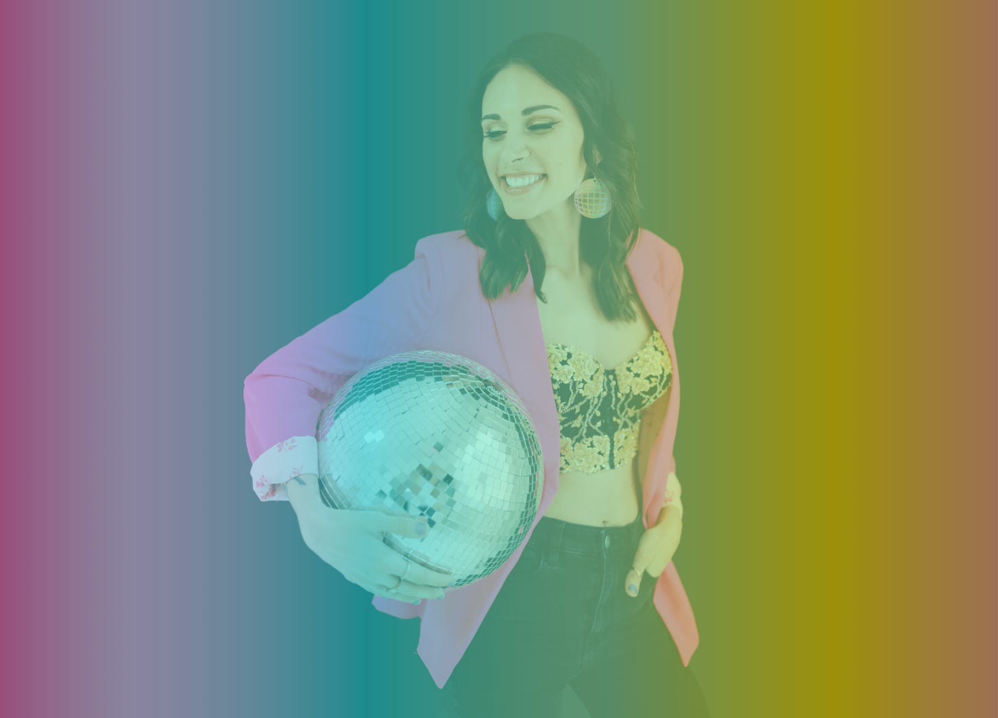 A rainbow-filtered photo of Shohreh smiling and holding a  large disco ball tucked underneath one arm while wearing black jeans, a black and gold bustier, and a hot pink blazer