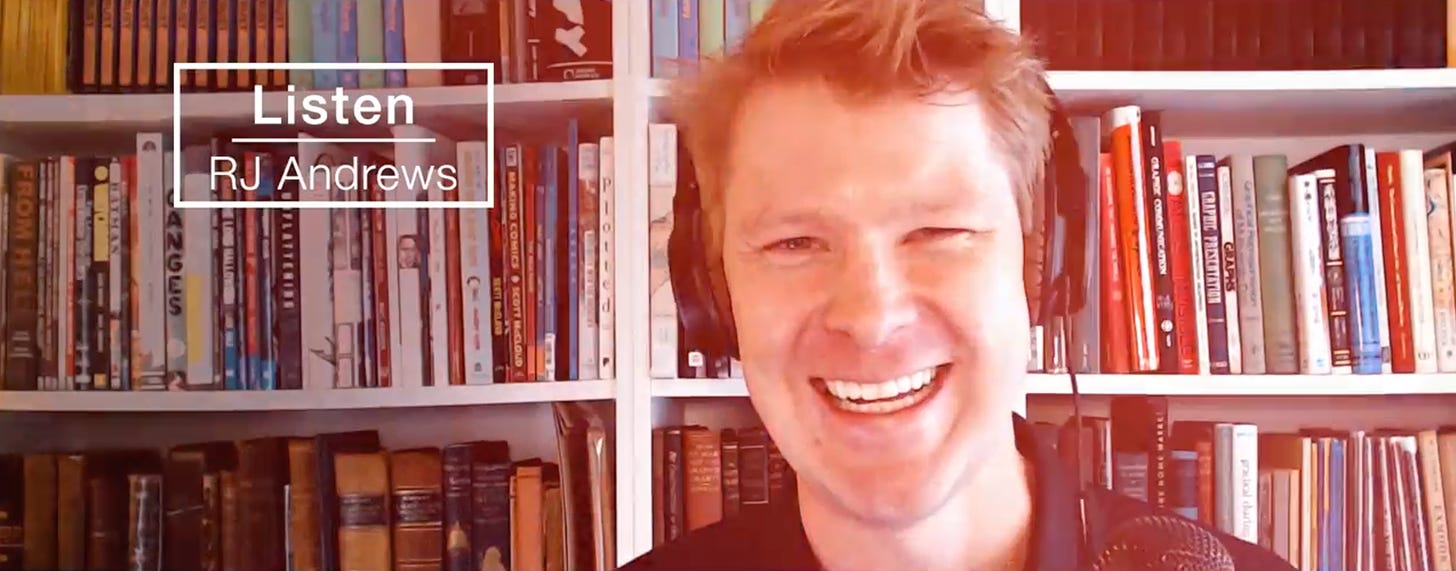 Photo of RJ Andrews smiling in front of a book shelf