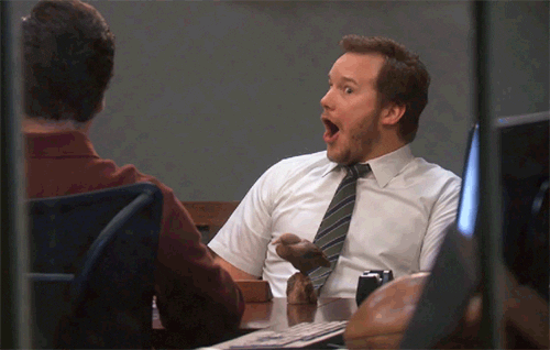 Chris Pratt as Andy on Parks and Rec looking excitedly amazed