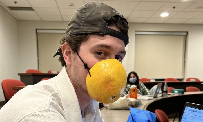 Kamil Bachouchi, a student at Wilfrid Laurier University, is protesting the school's mandatory masking policy in class by wearing a hollowed-out grapefruit. (Courtesy of Kamil Bachouchi)