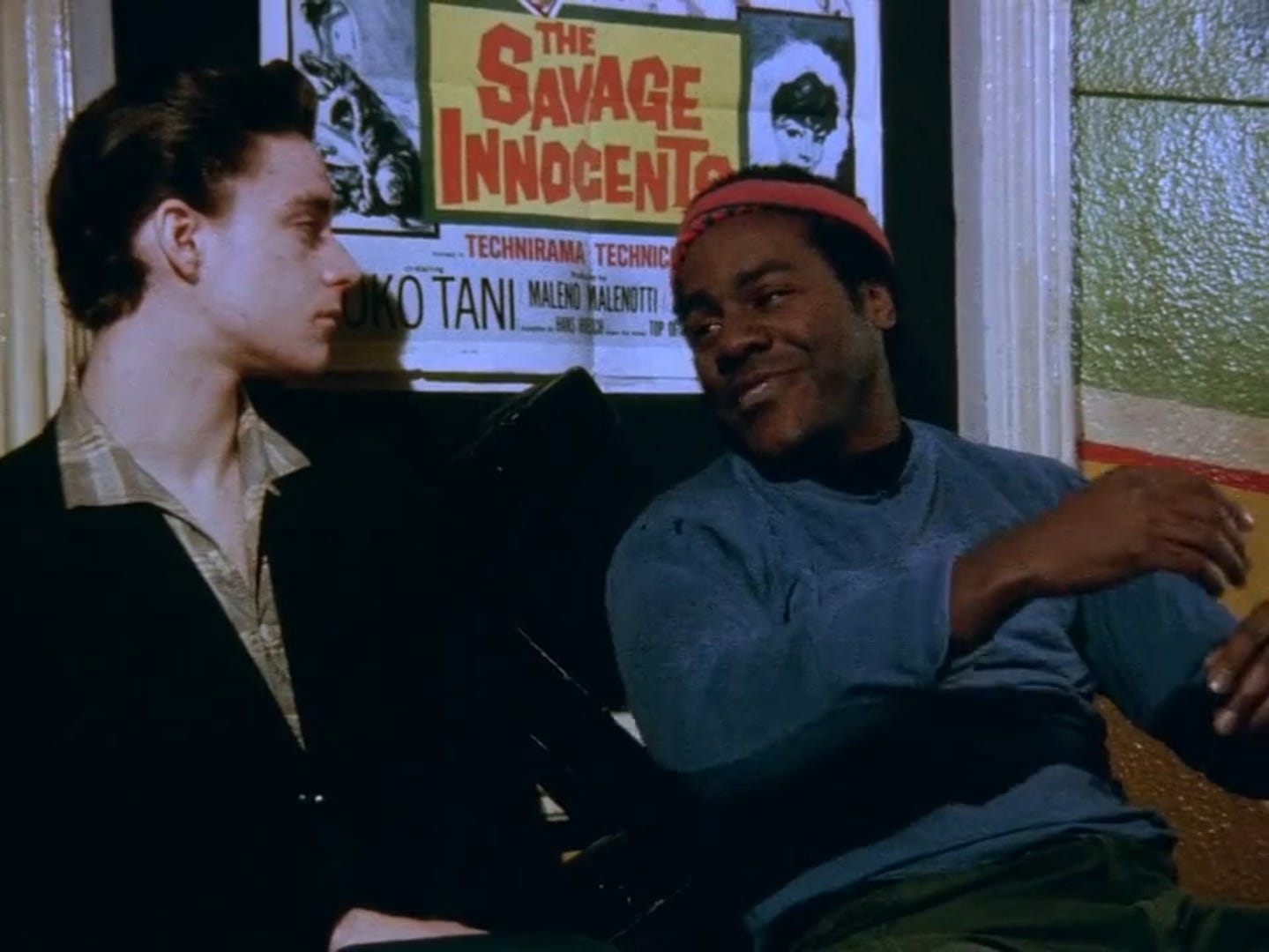 Allie (on the left) listens to Frankie Faison’s character telling him a story.