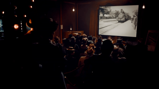 Gif of an audience flinching at the Lumière brothers 1896 short “The Arrival Of The Train At La Ciotat Station” from the 2011 film “Hugo.”