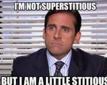 a screenshot of Michael Scott with the text "I'm not superstitious, but I am a little stitious"