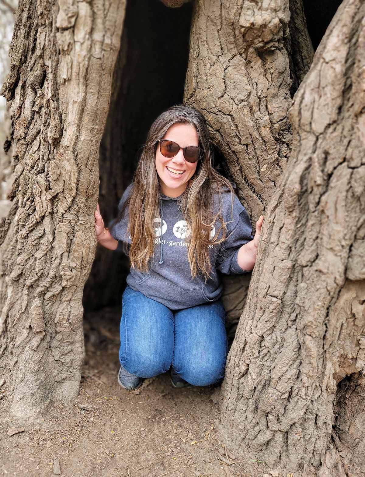 Dani hiding in the hollow of a tree. 