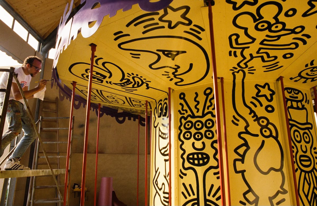 Keith Haring working on his Luna Luna carousel