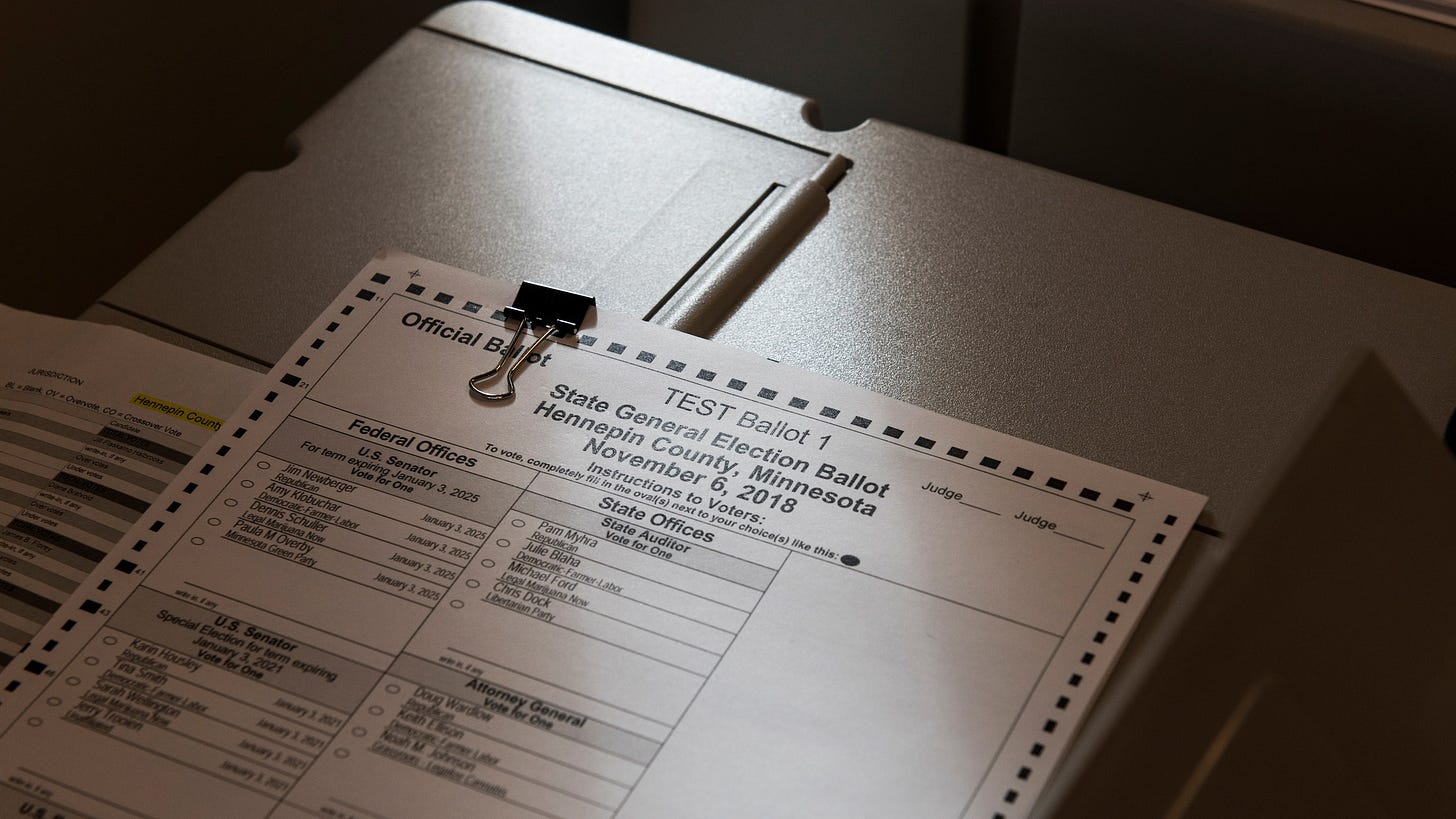Image of a ballot atop a voting machine