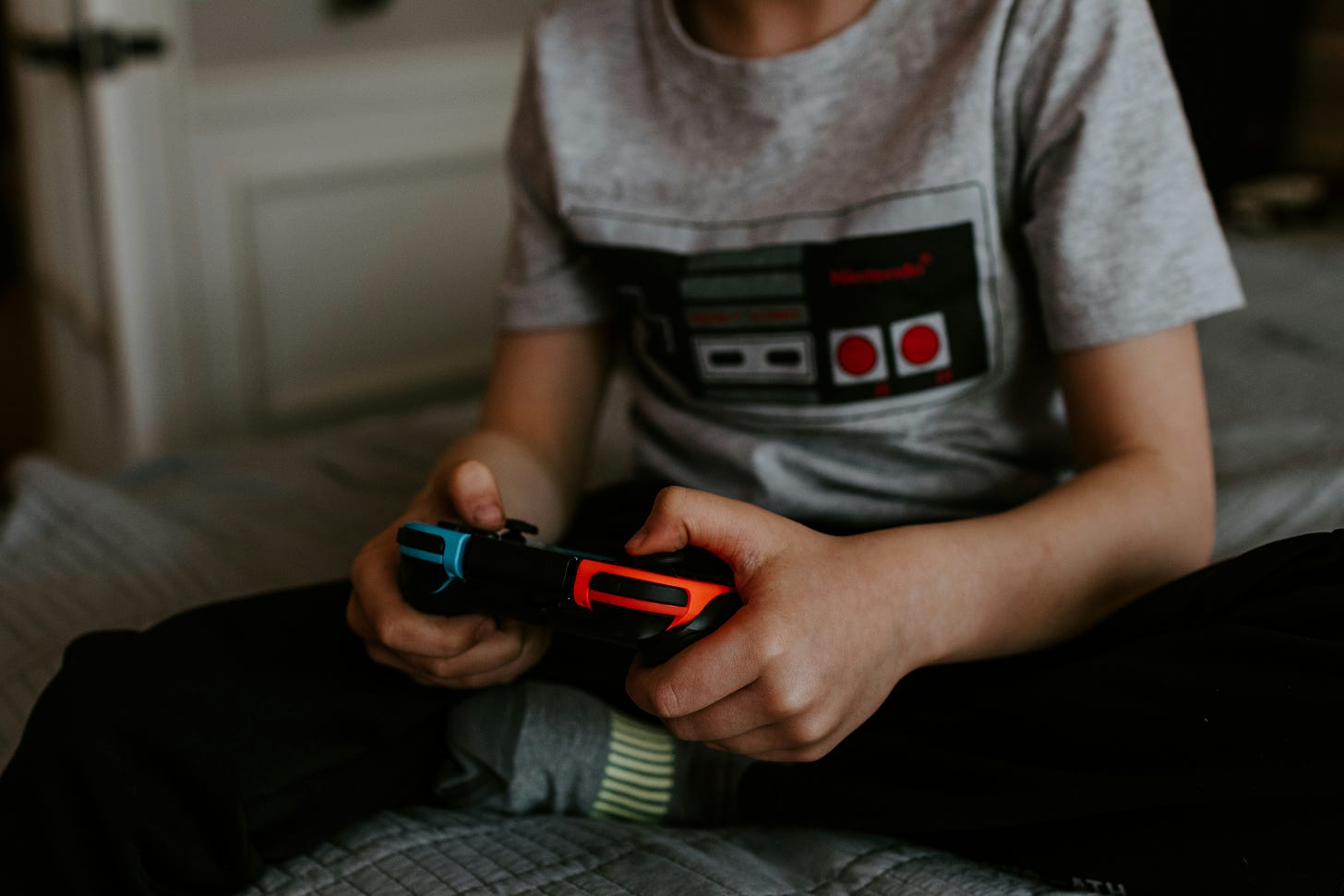 Picture of a child holding a Nintendo Switch controller