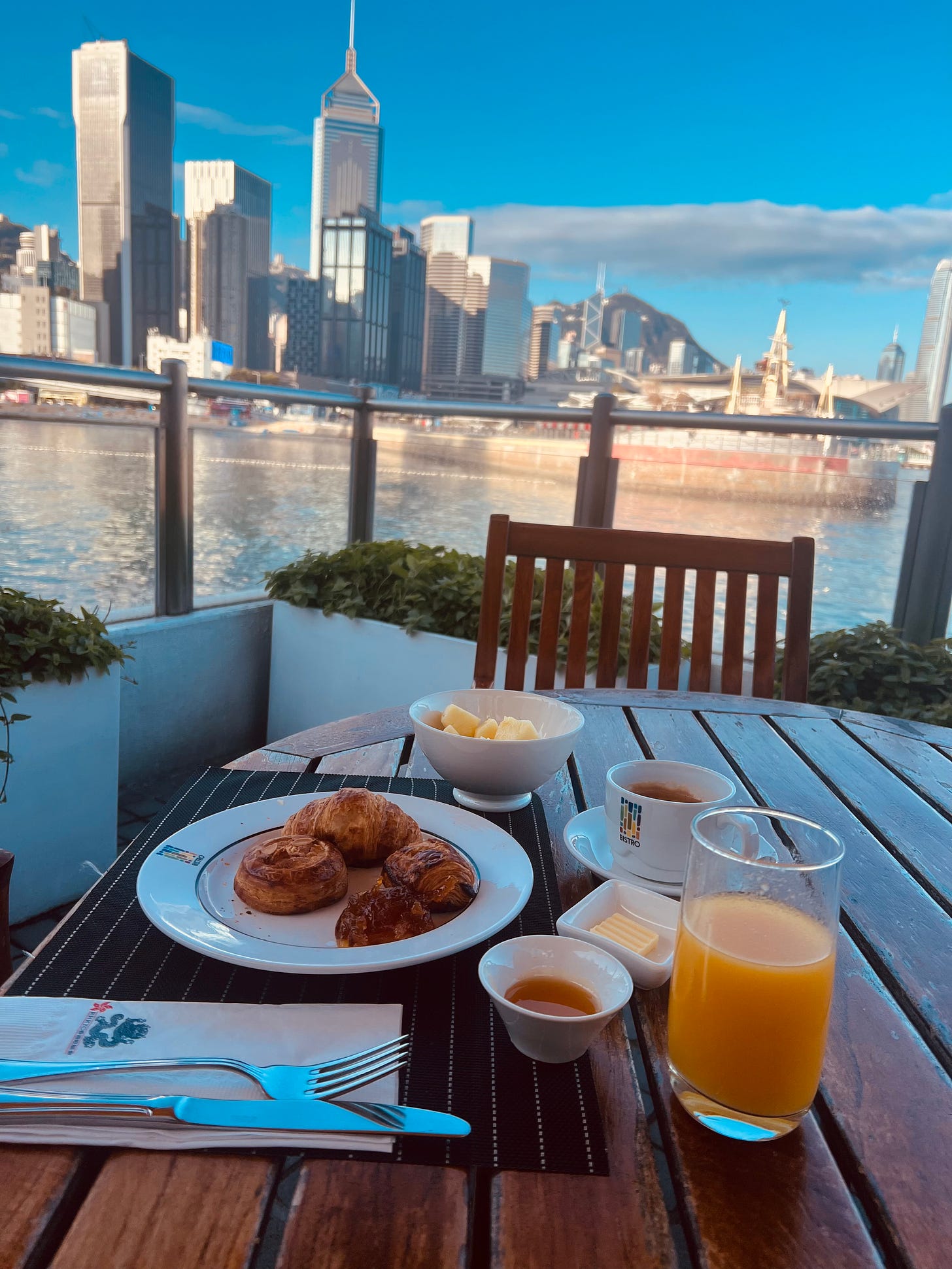 Picture of a breakfast with a harbour in the background