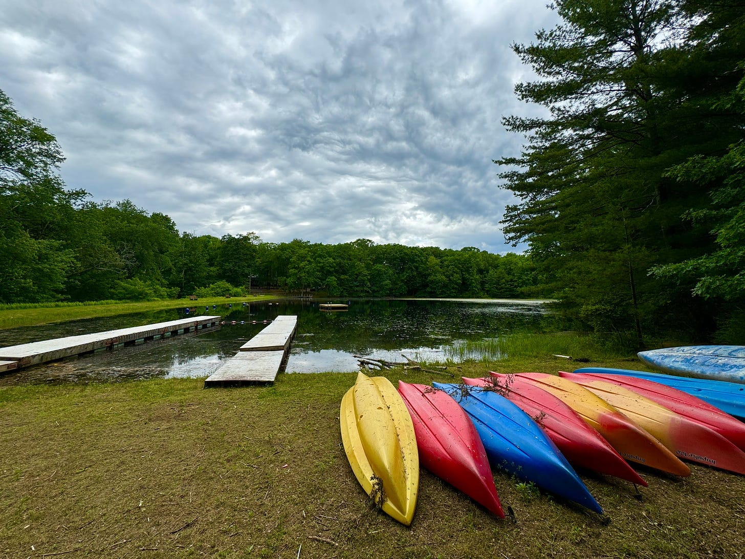 kayaks on the shore by the lake