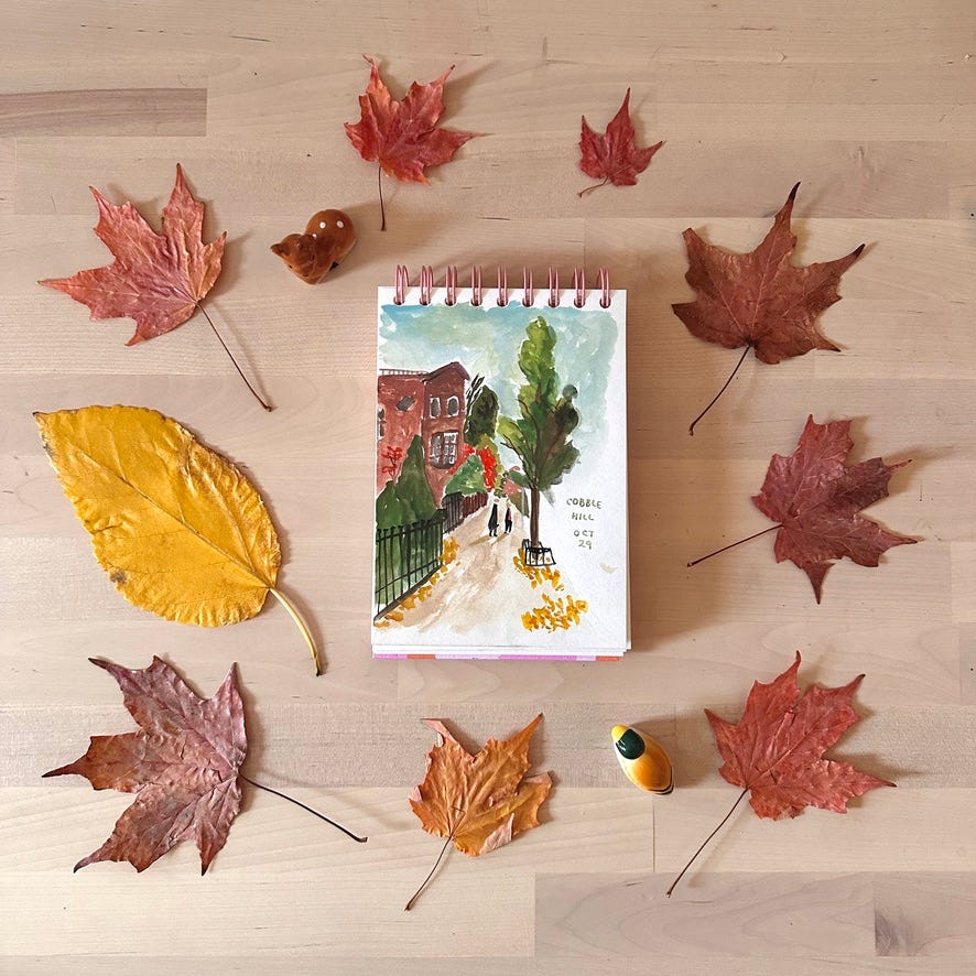 Autumnal painting surrounded by dried foliage