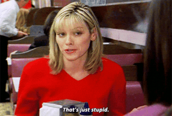 Kim Cattrall, nei panni di Samantha Jones. Donna vestita di rosso, seduta in un ristorante, pronuncia la frase 'That's just stupid' con espressione sarcastica. GIF tratta da una scena di Sex & The City. Kim Cattrall, nei panni di Samantha Jones. Donna vestita di rosso, seduta in un ristorante, pronuncia la frase 'That's just stupid' con espressione sarcastica. GIF tratta da una scena di Sex & The City.