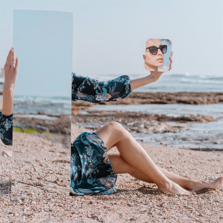 Woman on beach and a trick of mirrors.