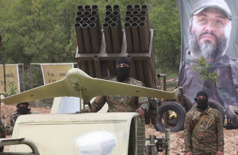  Hezbollah members take part in a military exercise during a media tour organized for the occasion of Resistance and Liberation Day, in Aaramta, Lebanon May 21, 2023 (photo credit: AZIZ TAHER/REUTERS)