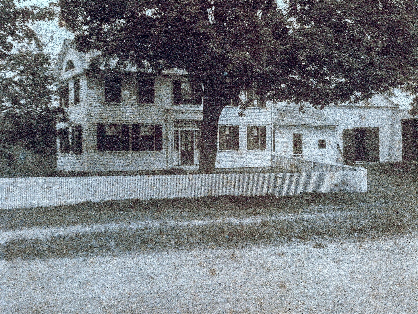 house with tree, fence and barn