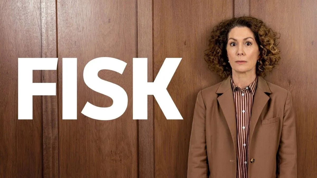 Promo shot for Fisk, featuring the main character, a white woman with frizzy curls, looking confused against a wooden wall.