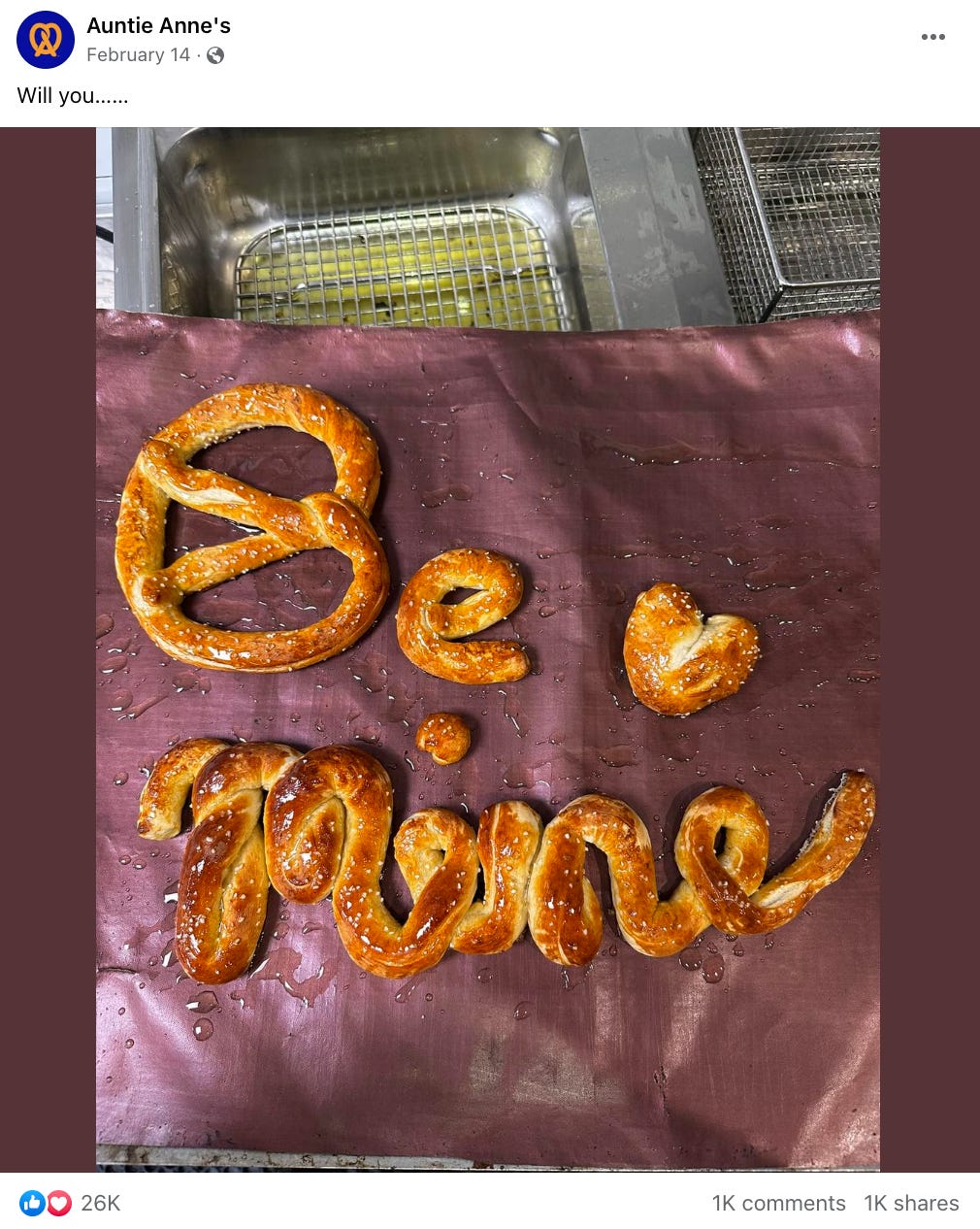 example facebook post from auntie anne's that says "will you..." and then shows a photo of pretzels spelling out "be mine"