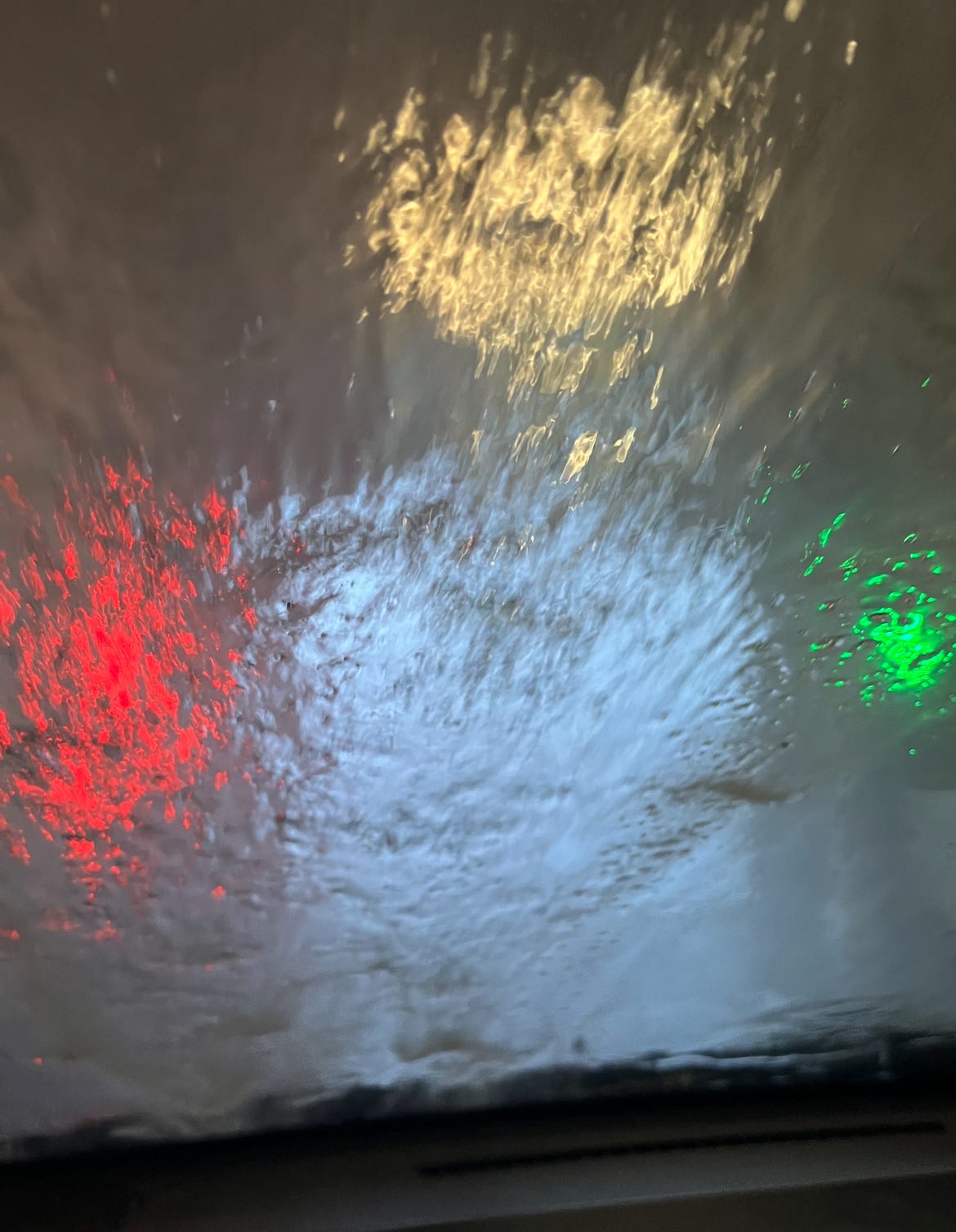 The inside of my van's winshield while we're getting a car wash