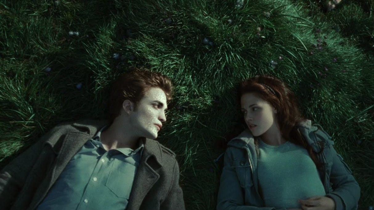 Robert Pattinson as Edward Cullen and Kristen Stewart as Bella Swan in Twilight