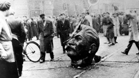 Image of a statue of Stalin being vandalised during the Hungarian uprising in 1956. 