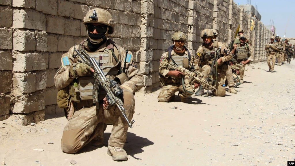Afghan National Army commandos take position during a military operation in Helmand Province in October 2016.