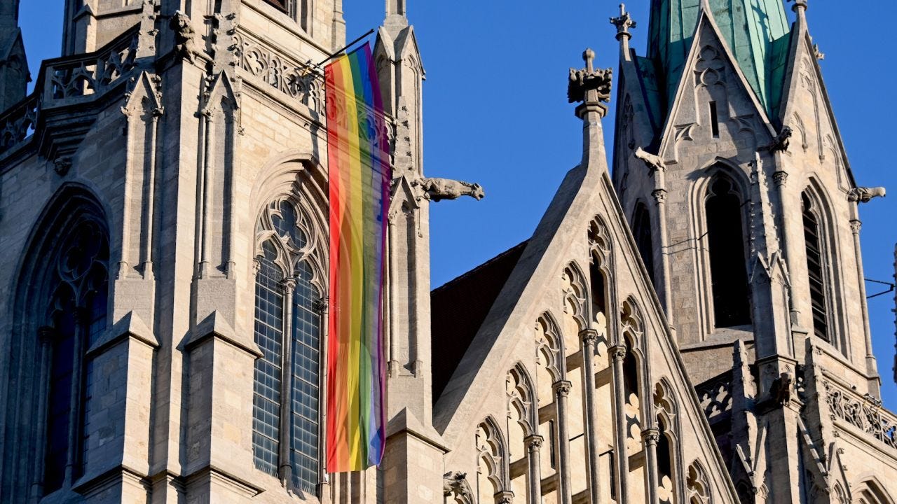 13 March 2022, Bavaria, Munich: A rainbow flag hangs at St. Paul's Church before the start of the queer service. The Archbishop of Munich, Cardinal Reinhard Marx held a queer service for the first time. Photo: Tobias Hase/dpa (Photo by Tobias Hase/picture alliance via Getty Images)