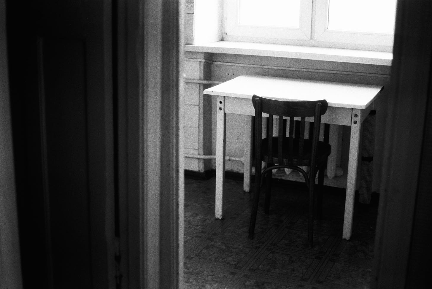 photo of empty desk under window