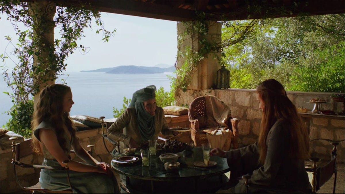 Sansa eating lemon cakes with the Tyrells.