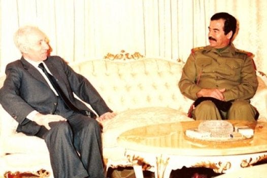 https://upload.wikimedia.org/wikipedia/commons/a/a0/Baath_Party_founder_Michel_Aflaq_with_Iraqi_President_Saddam_Hussein_in_1988.jpg