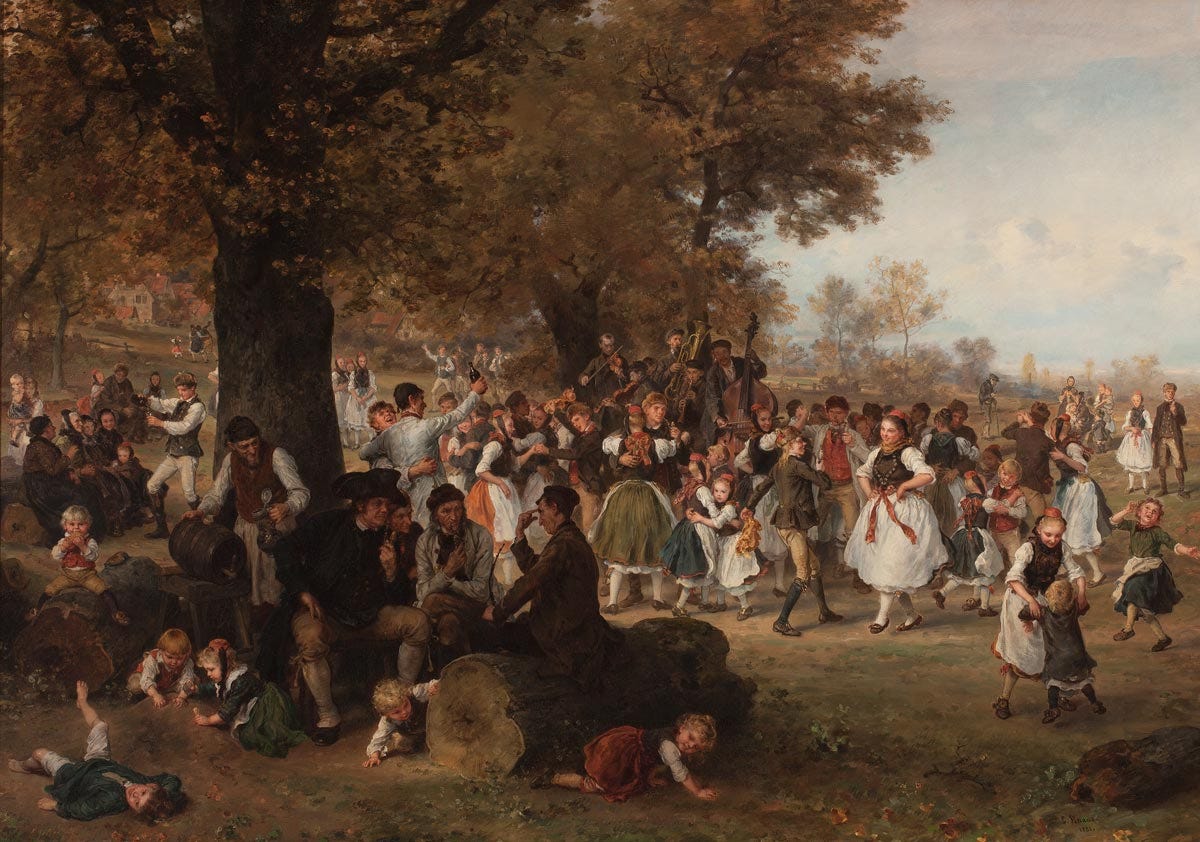 Gathering of people dancing underneath a large tree