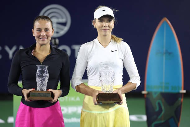 Runner up Marta Kostyuk of Ukraine and winner Katie Boulter of Great Britain pose with tournament trophies after the Cymbiotika San Diego Open 2024...